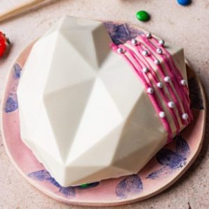 pinata white chocolate cake with hammer